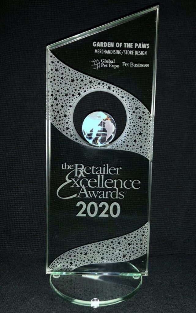 Glass award engraved with "Retailer Excellence Awards 2020" presented to Garden of the Paws for merchandising and store design.